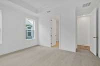 Your primary suite features a tray ceiling and your own private bathroom.