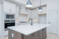 gas cooktop and wood vented chimney hood