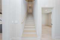 wood stairs leading up to 4th bedroom/bath and SPACIOUS bonus room