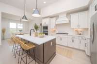 Kitchen with built-in jstove/micro and cabinets in the island-virtually staged