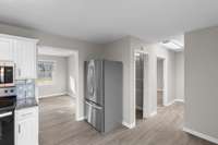 Pantry and laundry area adjacent to kitchen