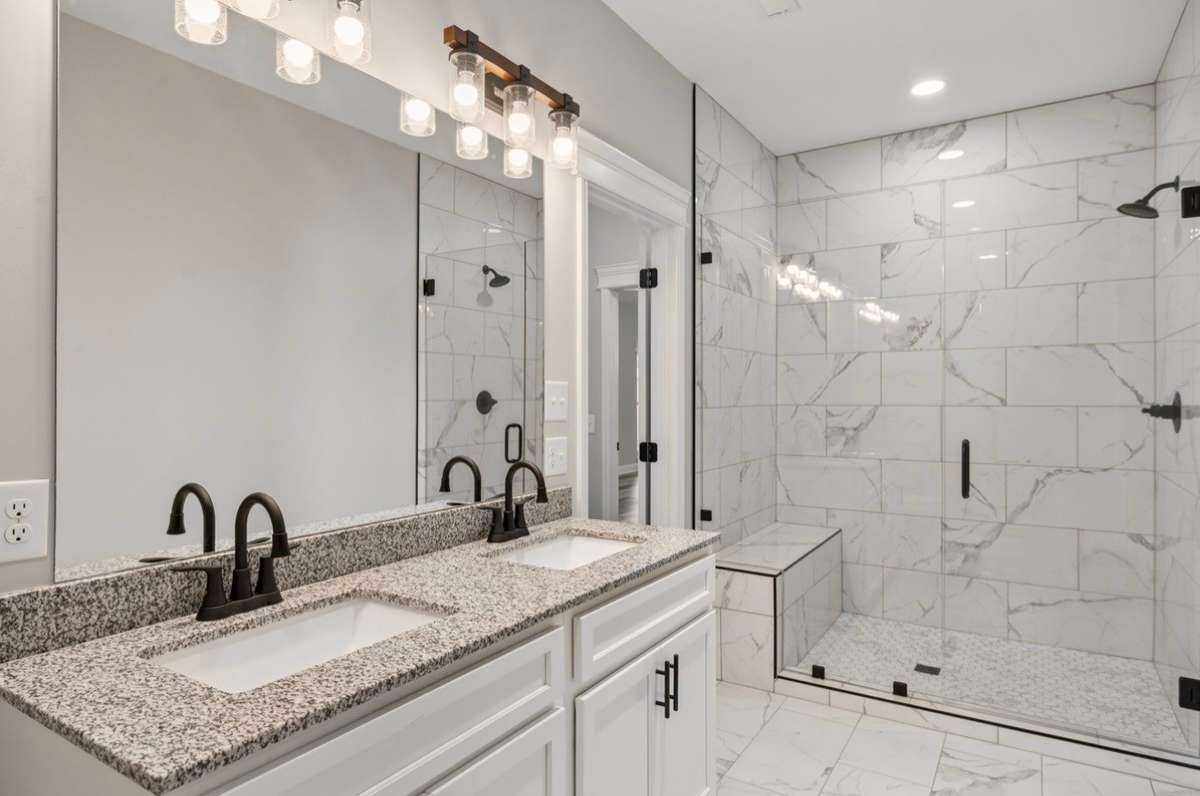 Primary Bath Room with a Double Vanity and extra large marble Shower