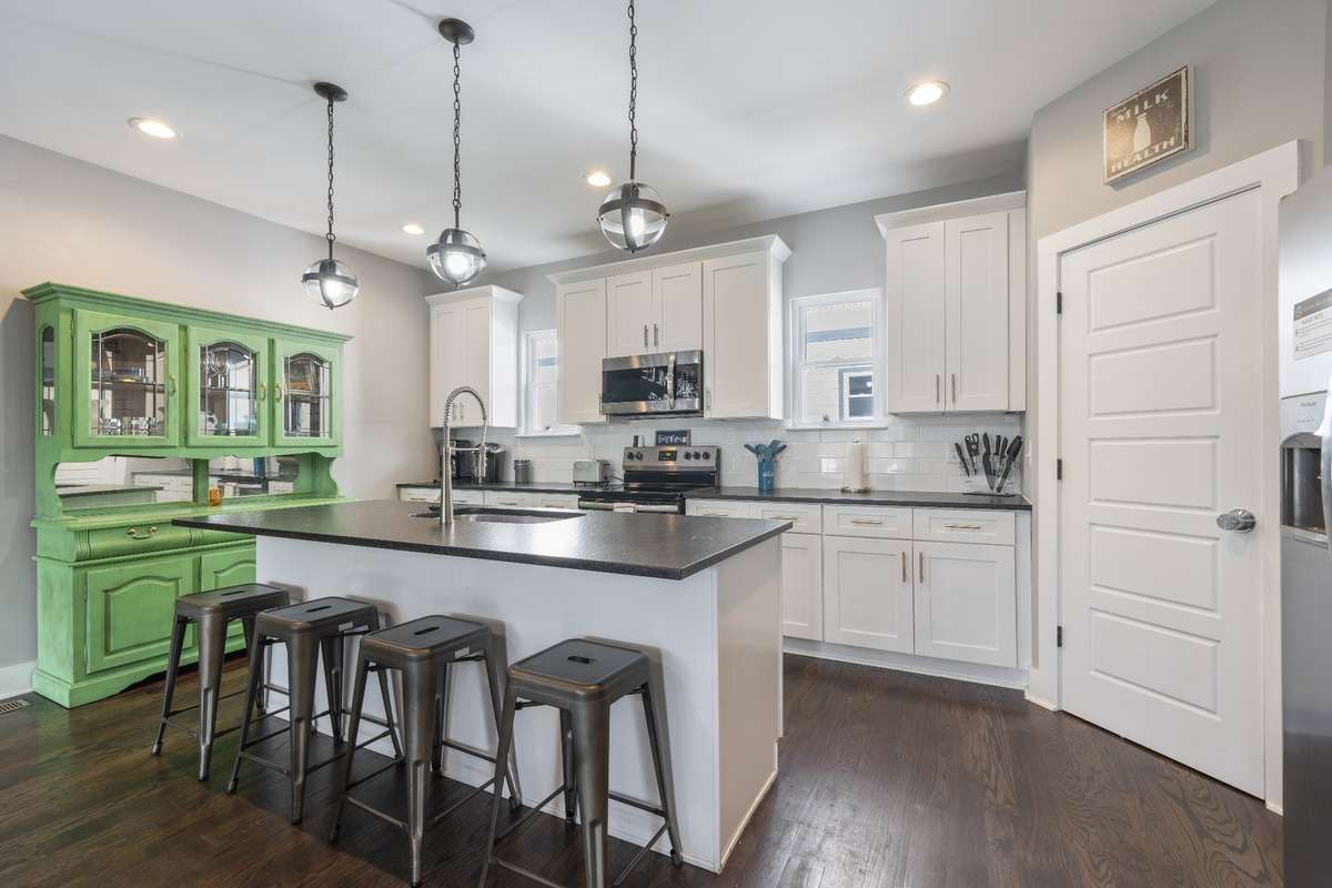 This fantastic kitchen also has a large walk-in pantry