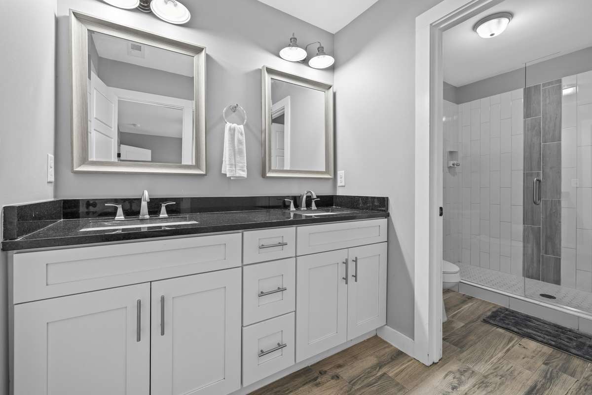 Primary bathroom with double vanities and separation for the  shower and toilet