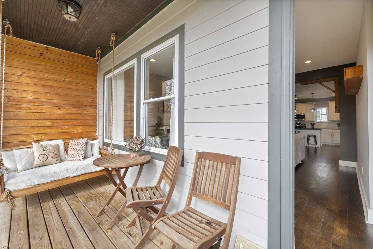 Another view of the upstairs deck with porch swing