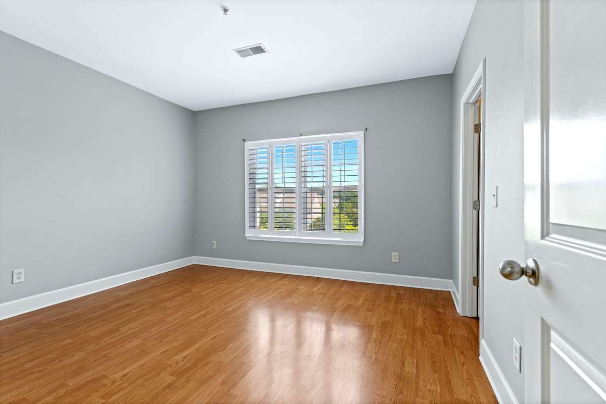 The second bedroom is a large 14x12 space with great plantation shutters.