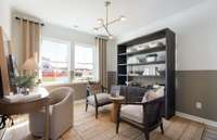 ***Photo is from a brand new Rosella Model home*** Located on the 1st floor, the Flex Space is perfect for those that need a home office or workout room. You can also use this space as a formal dining room as well.