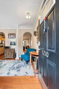 Open Yet Charming Entry to Formal Dining/Office. Double Arched doorways lead into Beautifully appointed Kitchen.