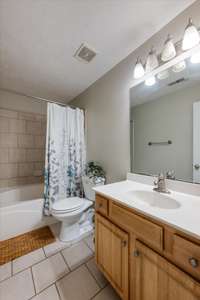 Upstairs Full Bath with Tile Floors and Tile Tub Surround
