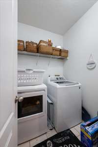 Large Laundry Room. Washer & Dryer Convey with Home.