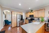 Upgraded Appliances, Undermounted Sink and Solid Surface Counters together with Light Wood Cabinetry give a modern and stylish kitchen.