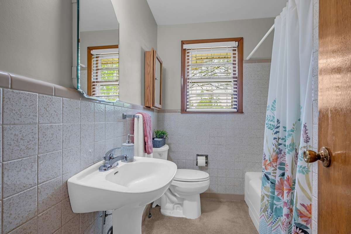 Full bath.  Nice window.  No hardwood under this carpet.