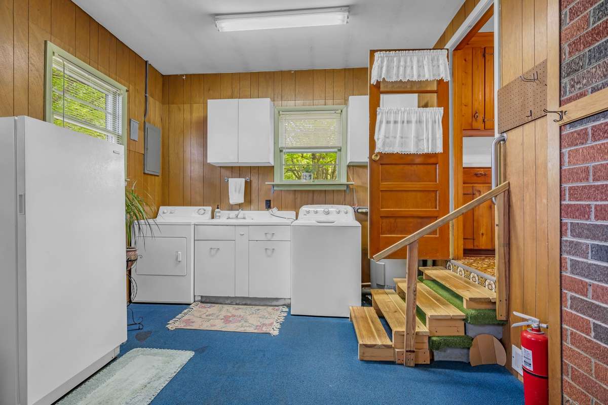 So much space in the laundry room.  Washer, Dryer & Sink included.  Plenty of room for exercise equipment or freezer.