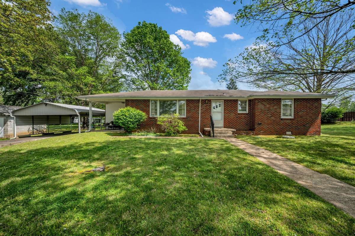 Double carport conveniently located with steps to the patio.