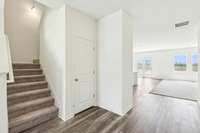 View of stairs & extra storage closet