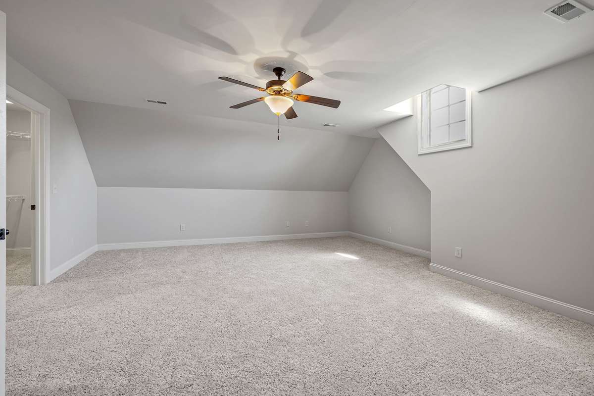 An oversized playroom or home office includes a closet to accommodate all your essential materials.