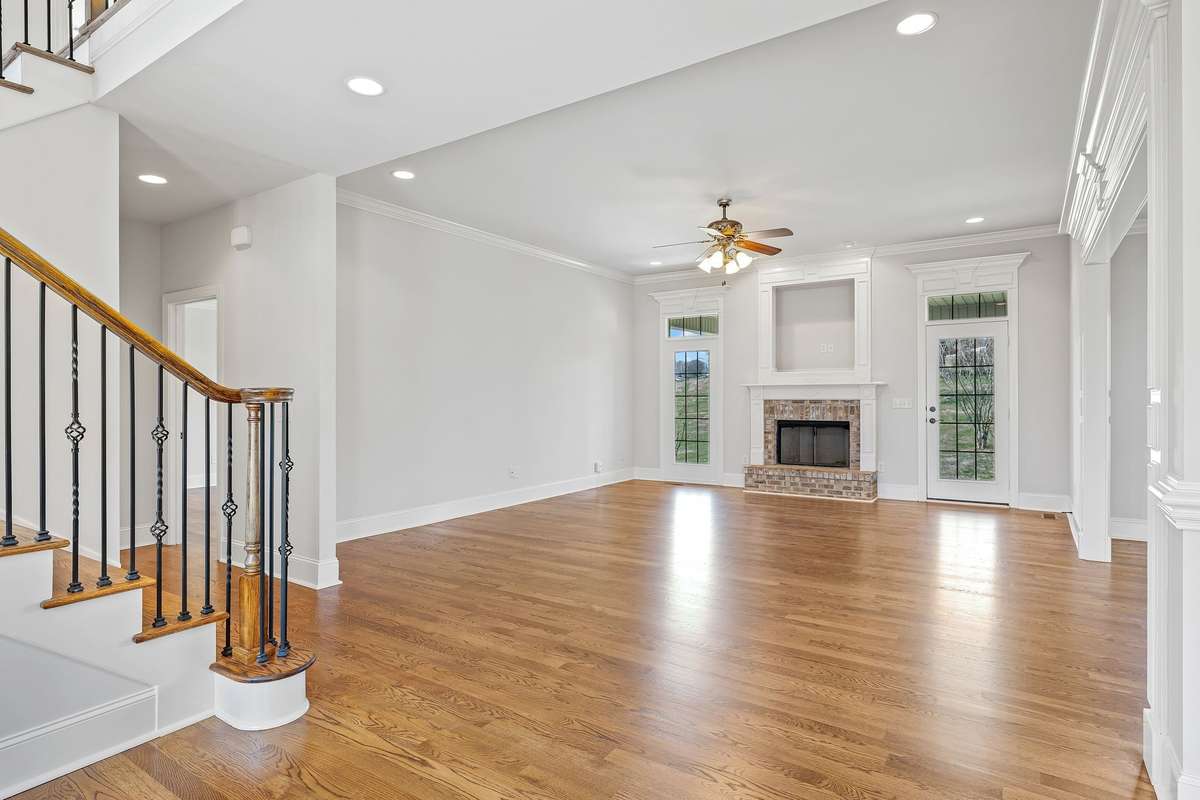 The living room is grand in scale. Tall ceilings, exquisite moldings.
