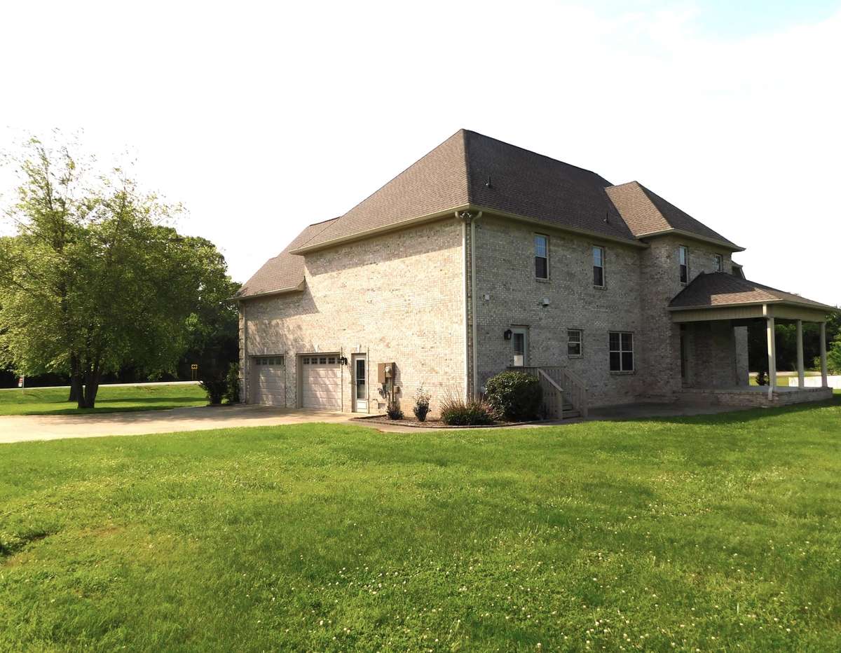 Side view of home showing 2-car garage.