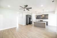 Large open living room & kitchen~LVP flooring throughout!