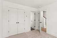 Enjoy the privacy and convenience of this inviting secondary bedroom, complete with its own en-suite bathroom. Perfect for guests or family members!