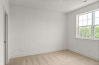 Another view of your welcoming secondary bedroom featuring generous dimensions, this room offers plenty of space for relaxation and personalization.