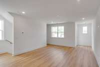 Step into this beautifully designed open living space that seamlessly connects the dining area and kitchen, creating an ideal space for entertaining and family gatherings. The expansive layout is flooded with natural light.