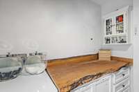 Beautiful live edge folding table in laundry room