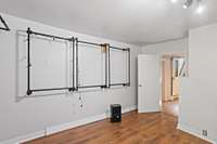 Second downstairs bedroom setup as a dressing room/large closet