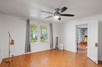 Primary bedroom has great view of the front porch