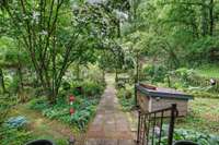 Beautiful gardens line the entrance to the house