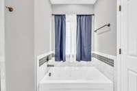 Jetted Tub w/ a Window Above For Natural Light