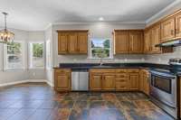 Large kitchen with lots of counterspace, granite counter tops, stainless appliances with tile flooring