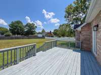 Large deck off the back with a large fenced yard