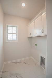 Spacious Laundry Room with Tile Flooring!