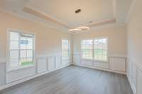 Spacious Formal Dining Room with a Coffered Ceiling & Beautiful Wainscoting!