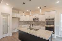 Kitchen Features a Large Island, Granite Counter Tops, Smart Double Oven & a Walk-in Pantry!