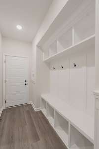 Off the Garage is a Mudroom w/ a Built-in Hall Tree & a Laundry Chute!