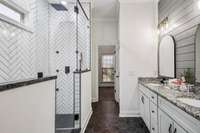 Beautifully updated shower large enough for 2.  Linen closet further on the left and private watershed on the right
