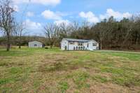 Front view of property showing home and shop