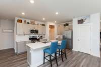 KITCHEN WITH SS APPLIANCES AND LG QUARTZ ISLAND