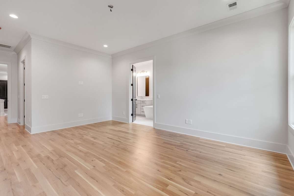 It includes a large ensuite bathroom, offering ample space and modern amenities for comfort and relaxation. 6369 Alamo Pl  Nashville, TN