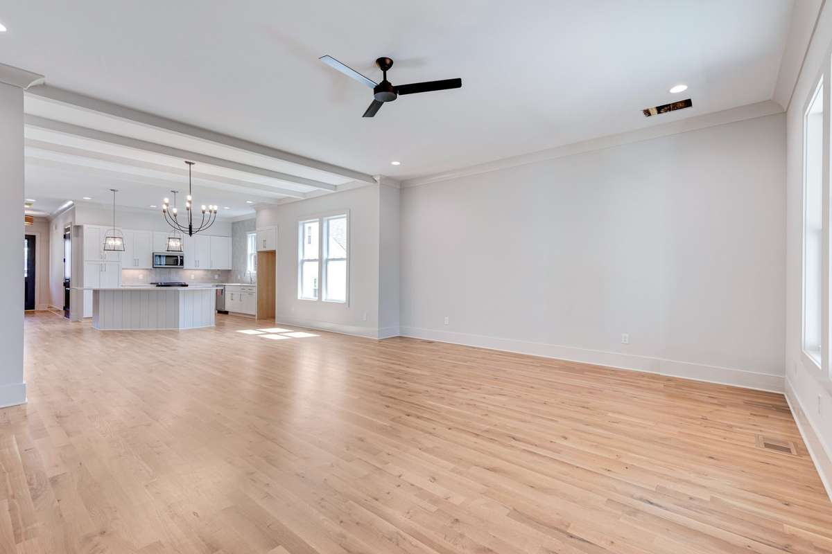 The space is adorned with a neutral paint scheme and light wood floors that extend throughout the entire home. 6369 Alamo Pl  Nashville, TN