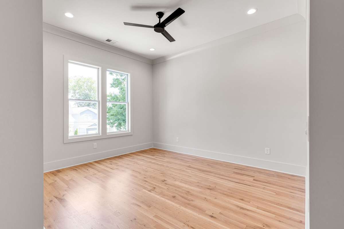 The third bedroom is elegantly designed with crown molding and illuminated by two single windows. 6369 Alamo Pl  Nashville, TN