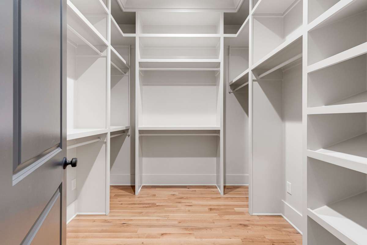 The primary bedroom includes a large walk-in closet with custom-built shelving and storage solutions. 6369 Alamo Pl  Nashville, TN