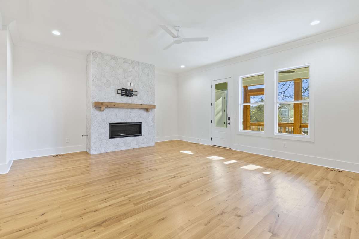 Beautiful living room with hardwood flooring, recessed lights, & ceiling fan. 6371 Alamo Pl Nashville TN 37209