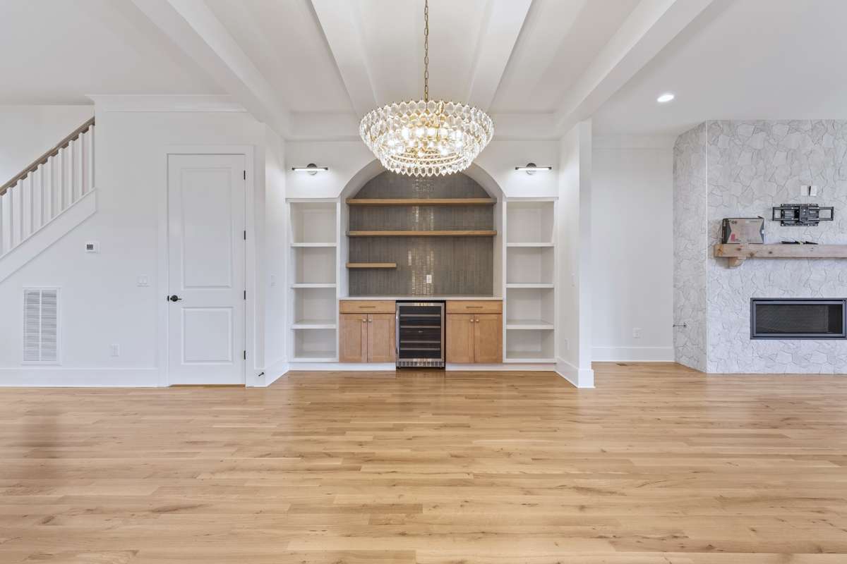 Gorgeous formal dining area with chandelier, hardwood flooring, & built in bar area. 6371 Alamo Pl Nashville TN 37209
