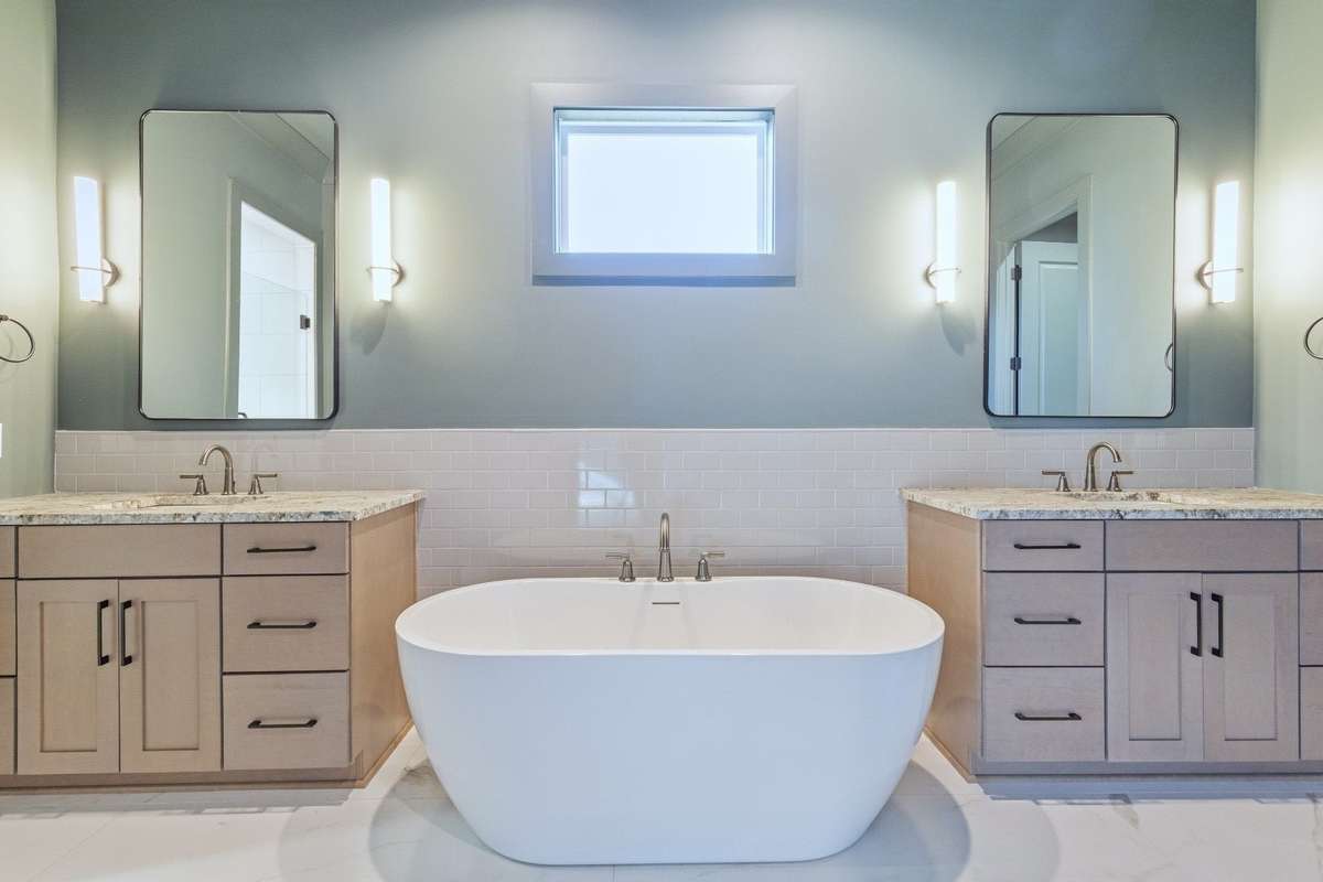 Beautiful primary bath with spa like feel, features double vanities & garden tub - perfect for relaxing. 6371 Alamo Pl Nashville TN 37209