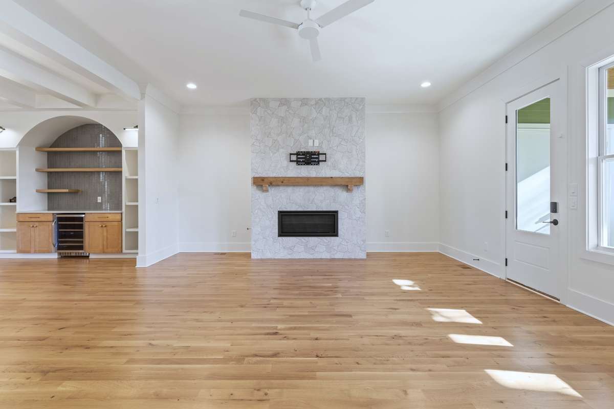Your living room also features a fireplace, wooden mantle, & outdoor access. 6371 Alamo Pl Nashville TN 37209