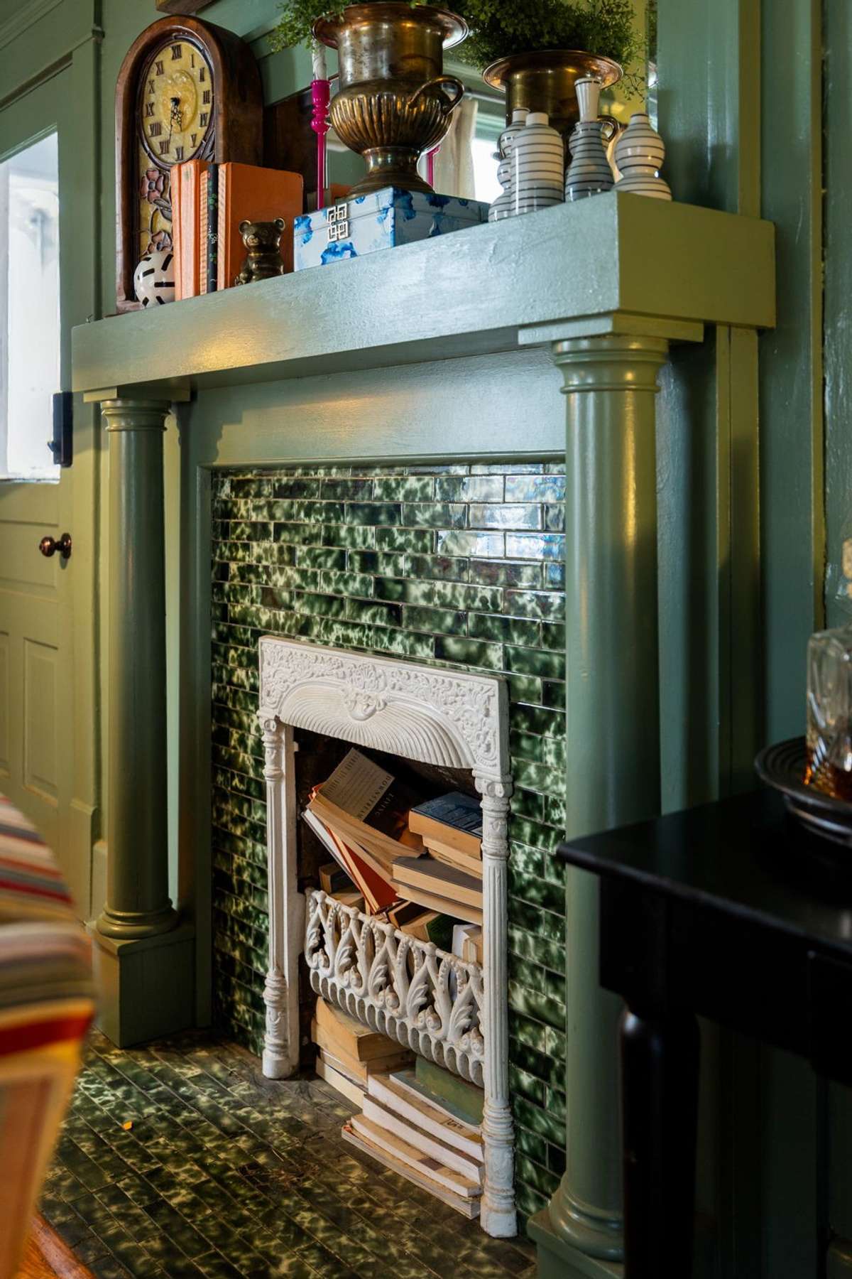 Original tile fireplace with carved mantle.