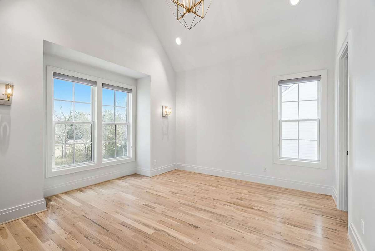 Upstairs bedrooms have vaulted ceilings and en suite baths